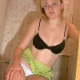 A blonde, Eastern-European girl farts repeatedly while sitting on a toilet. She is not pooping. Her panties are only partially pulled down to prevent any accidental messes.